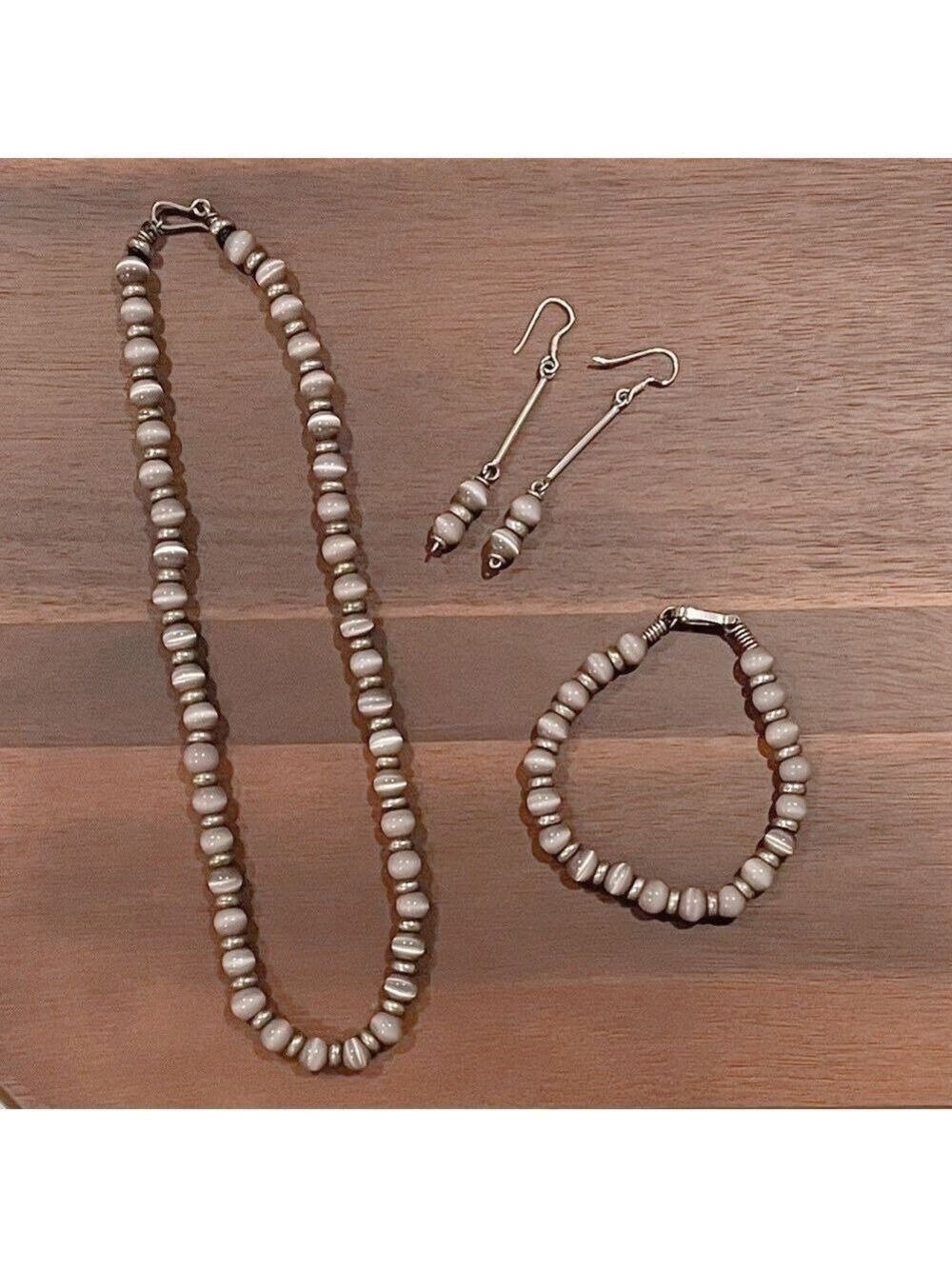 Purple Cat Eye Stone with Silver Necklace Bracelet and Earrings.